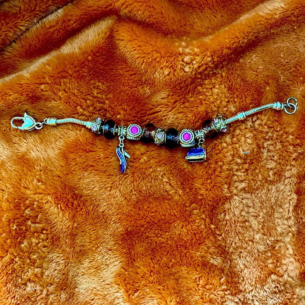 Silver bracelet w/ purple charms